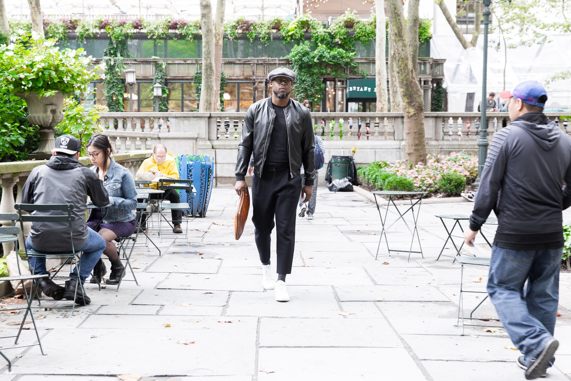 Jason Rosario walking through Bryant Park, New York