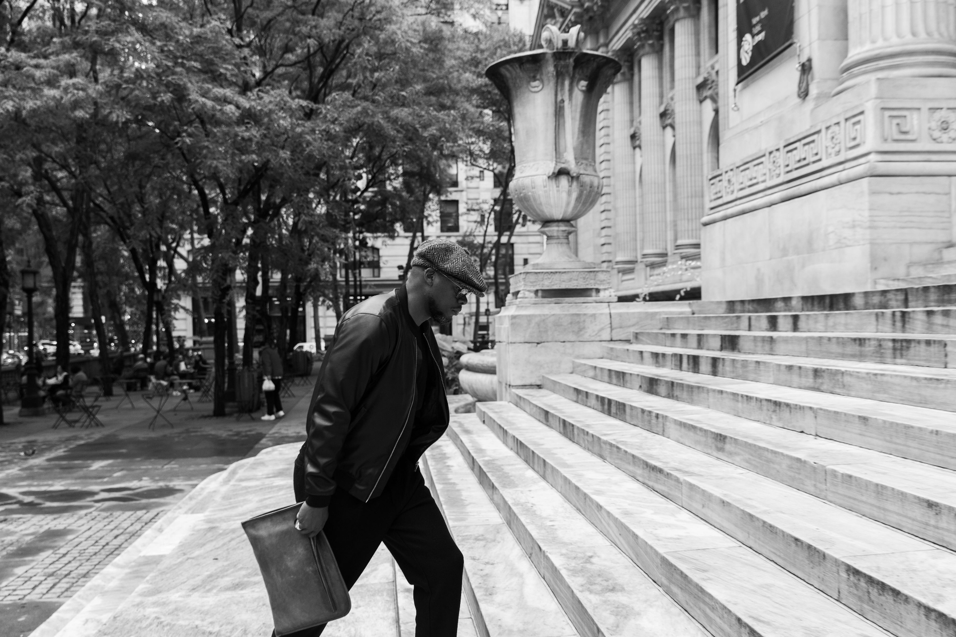 Jason Rosario climbing a flight of stone steps