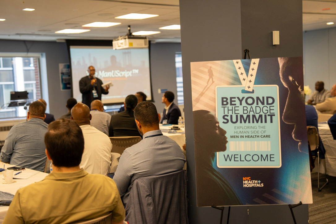 The Beyond the Badge Summit welcome banner in the room